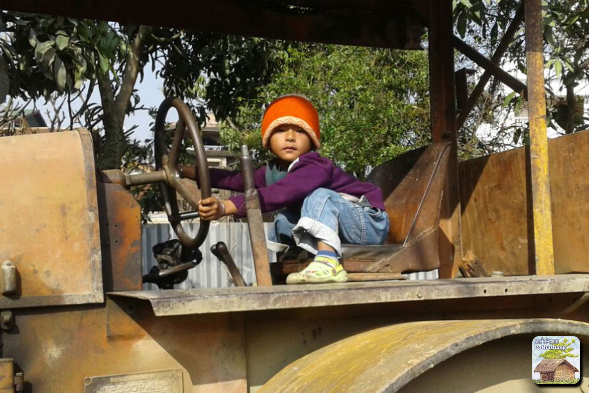 A child playing on a road roller